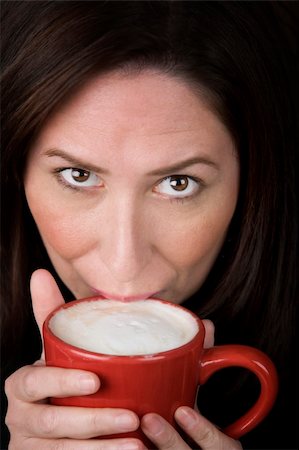 simsearch:400-04554624,k - Woman with coffee specialty drink in a red cup Stock Photo - Budget Royalty-Free & Subscription, Code: 400-04082607