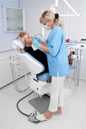 doctor works with patient in the dentist office Stock Photo - Budget Royalty-Free & Subscription, Code: 400-04082844