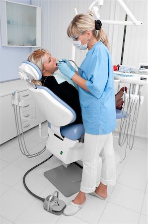 dental drill - doctor works with patient in the dentist office Stock Photo - Budget Royalty-Free & Subscription, Code: 400-04082928