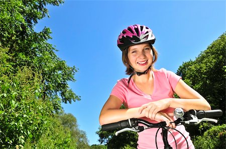 simsearch:400-04890875,k - Portrait of a teenage girl on a bicycle in summer park outdoors Stock Photo - Budget Royalty-Free & Subscription, Code: 400-04083694