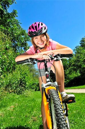 simsearch:400-04890875,k - Portrait of a teenage girl on a bicycle in summer park outdoors Stock Photo - Budget Royalty-Free & Subscription, Code: 400-04083696