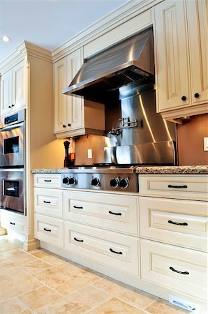 Interior of modern luxury kitchen with stainless steel appliances Foto de stock - Super Valor sin royalties y Suscripción, Código: 400-04083781