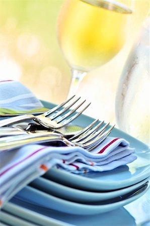 simsearch:400-05178995,k - Table setting with stack of plates and cutlery Stock Photo - Budget Royalty-Free & Subscription, Code: 400-04083794