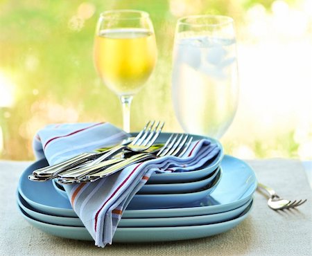 Table setting with stack of plates and cutlery Stock Photo - Budget Royalty-Free & Subscription, Code: 400-04083791