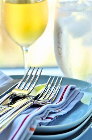 Table setting with stack of plates and cutlery Stock Photo - Budget Royalty-Free & Subscription, Code: 400-04083793