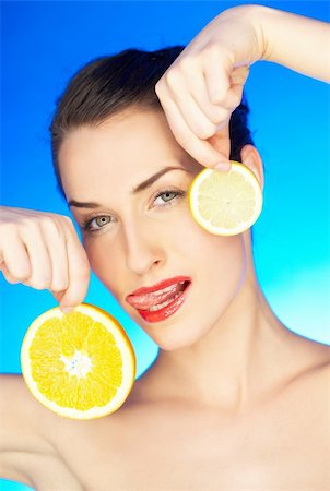 simsearch:400-05192072,k - Portrait of beautiful woman with citrus slices Photographie de stock - Aubaine LD & Abonnement, Code: 400-04083897