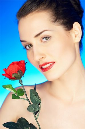 simsearch:400-04320148,k - Portrait of beautiful woman with red rose Photographie de stock - Aubaine LD & Abonnement, Code: 400-04083893