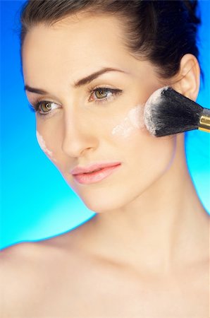 simsearch:400-04083912,k - Portrait of beautiful woman with cosmetics brush Stock Photo - Budget Royalty-Free & Subscription, Code: 400-04083914