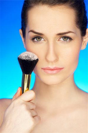 simsearch:400-04320148,k - Portrait of beautiful woman with cosmetics brush Photographie de stock - Aubaine LD & Abonnement, Code: 400-04083912