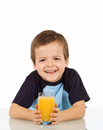 simsearch:400-04218582,k - Little boy with a glass of fruit juice leaning on the table - isolated Stockbilder - Microstock & Abonnement, Bildnummer: 400-04094337