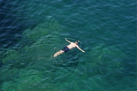 A man snorkeling in the cool waters of Georgian Bay, Ontario, Canada. Stockbilder - Microstock & Abonnement, Bildnummer: 400-04094531