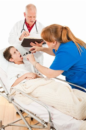 Little boy being treated by a doctor and nurse in a pediatric hospital. Photographie de stock - Aubaine LD & Abonnement, Code: 400-04094585