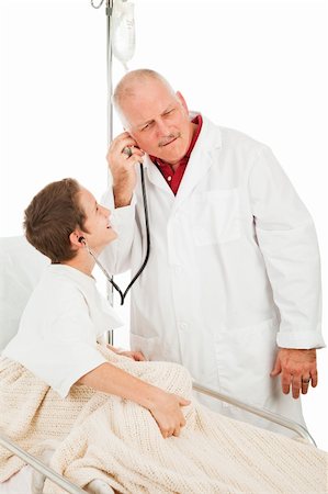 patient on gurney with male doctor - Cute little boy in the hospital being entertained by a friendly doctor.  Isolated on white. Photographie de stock - Aubaine LD & Abonnement, Code: 400-04094580