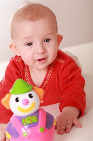 Portrait of cute newborn playing with toys Stock Photo - Budget Royalty-Free & Subscription, Code: 400-04095364