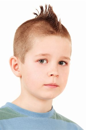 Young schoolboy in closeup portrait isolated on white background Stock Photo - Budget Royalty-Free & Subscription, Code: 400-04095420