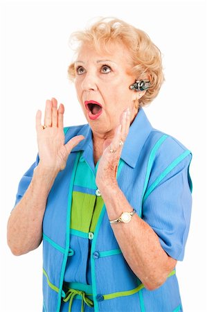 sad grandmother - Senior lady on hands free set receives shocking news via cellphone.  Isolated on white. Stock Photo - Budget Royalty-Free & Subscription, Code: 400-04096289