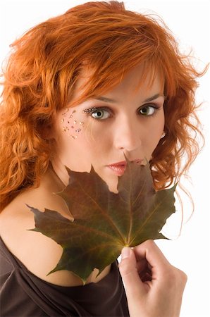 simsearch:400-04552932,k - cute red haired girl with an autumn leaf Stock Photo - Budget Royalty-Free & Subscription, Code: 400-04096495