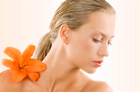simsearch:400-04323317,k - great portrait of a blond girl with an orange flower on her shoulder Stock Photo - Budget Royalty-Free & Subscription, Code: 400-04097981