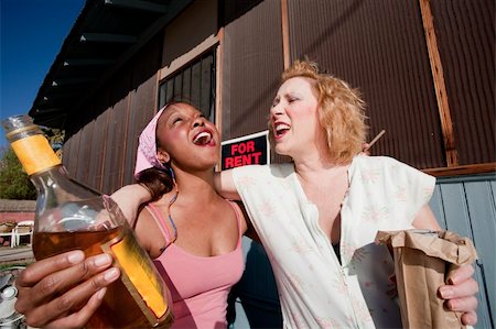 Portrait of two trashy drunk women outdoors Stock Photo - Budget Royalty-Free & Subscription, Code: 400-04099375