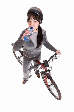 riding a bike funny pic - attractive brunette woman with bike. over white background Stock Photo - Budget Royalty-Free & Subscription, Code: 400-04099845