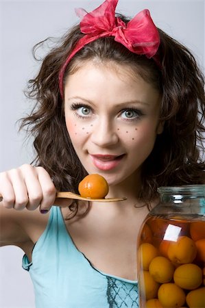 Close-up portrait of funny girl with stewed apricot Stock Photo - Budget Royalty-Free & Subscription, Code: 400-04092112