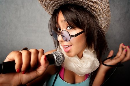 Pretty young singer with a large microphone Stock Photo - Budget Royalty-Free & Subscription, Code: 400-04093500