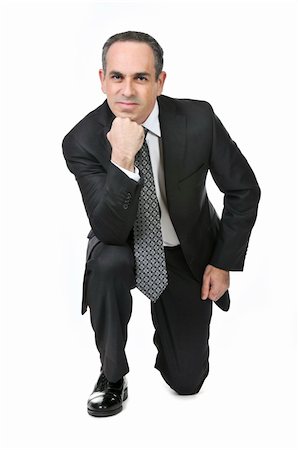 simsearch:400-04485729,k - Thinking businessman in a suit isolated on white background Stock Photo - Budget Royalty-Free & Subscription, Code: 400-04093562