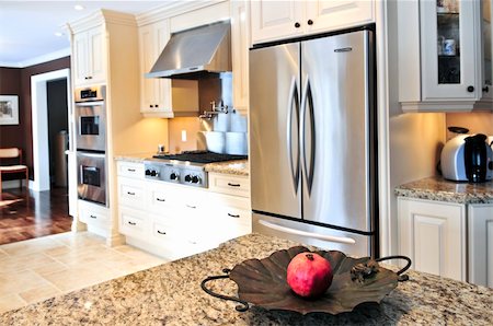 Interior of modern luxury kitchen with stainless steel appliances Foto de stock - Super Valor sin royalties y Suscripción, Código: 400-04093685