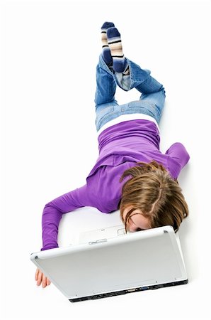 Tired young girl lying down asleep on laptop computer Stock Photo - Budget Royalty-Free & Subscription, Code: 400-04093777