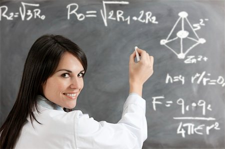 scientist and teacher photo - portrait of mid adult woman writing chemical formula on blackboard Stock Photo - Budget Royalty-Free & Subscription, Code: 400-04104269