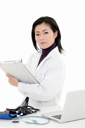 simsearch:400-05172792,k - Beautiful Asian woman Doctor/Nurse working at a desk Foto de stock - Royalty-Free Super Valor e Assinatura, Número: 400-04104346