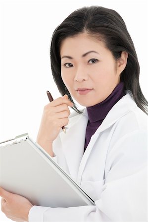 simsearch:400-05172792,k - Beautiful Asian woman Doctor/Nurse working at a desk Foto de stock - Royalty-Free Super Valor e Assinatura, Número: 400-04104348