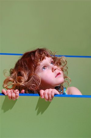 peeping fashion - portrait of a little shy girl looking out Stock Photo - Budget Royalty-Free & Subscription, Code: 400-04105314