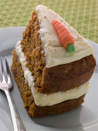 Slice Of American Carrot Cake On A Plate With A Fork Stock Photo - Budget Royalty-Free & Subscription, Code: 400-04105857