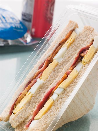 potatoes eggs bacon - Egg And Bacon Sandwich On White Bread With A Bag Of Crisps And A Stock Photo - Budget Royalty-Free & Subscription, Code: 400-04105897
