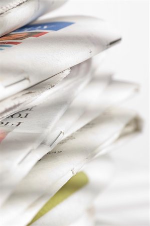 sunday market - pile of newspapers on the table Stock Photo - Budget Royalty-Free & Subscription, Code: 400-04106025