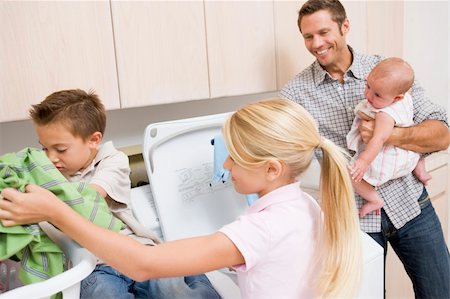 family with washing machine - Father And Children Doing Laundry Stock Photo - Budget Royalty-Free & Subscription, Code: 400-04106173