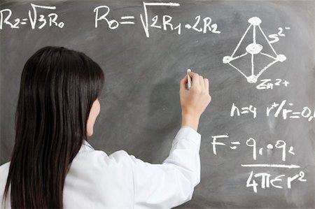 scientist and teacher photo - portrait of mid adult woman writing chemical formula on blackboard Stock Photo - Budget Royalty-Free & Subscription, Code: 400-04106182