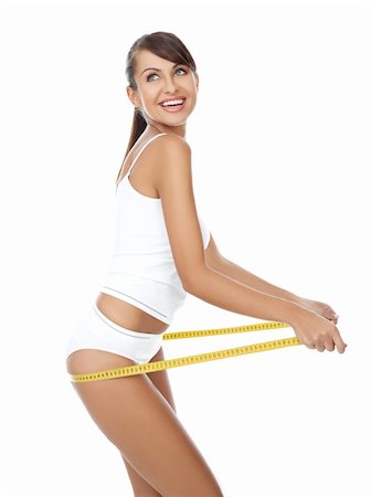 Young beautiful woman with measure tape on white Foto de stock - Super Valor sin royalties y Suscripción, Código: 400-04106835