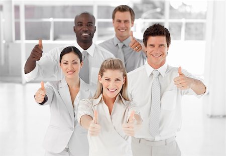 Positive Business Team Smiling and Holding up Thumbs to camera Stock Photo - Budget Royalty-Free & Subscription, Code: 400-04107243