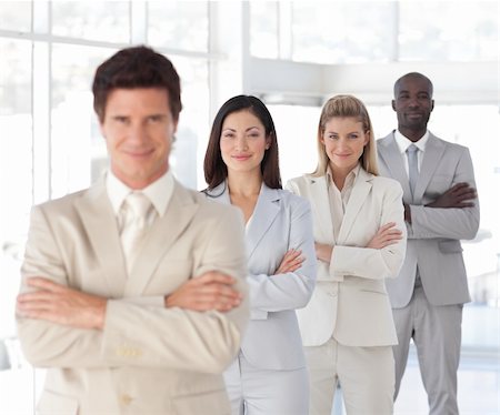 diversity indian workers - Young Business man with arms folded in front of Business Team Stock Photo - Budget Royalty-Free & Subscription, Code: 400-04107288