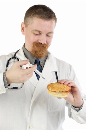 Smiling bearded doctor makes an injection into a hamburger with a syringe Foto de stock - Super Valor sin royalties y Suscripción, Código: 400-04107958