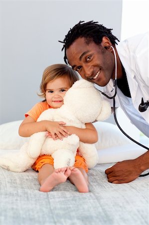stethoscope girl and boy - Caring Doctor with a child in a hospital Stock Photo - Budget Royalty-Free & Subscription, Code: 400-04108198