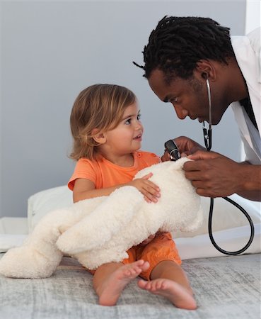 doctor checkup models pictures - Caring Doctor with a child in a hospital Stock Photo - Budget Royalty-Free & Subscription, Code: 400-04108200