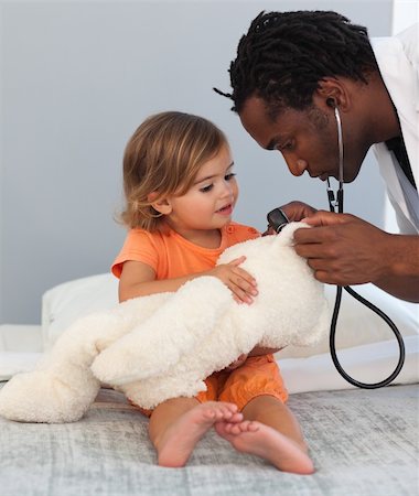 doctor checkup models pictures - Caring Doctor with a child in a hospital Stock Photo - Budget Royalty-Free & Subscription, Code: 400-04108201