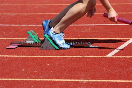 simsearch:400-05025032,k - Runner leaving starting blocks with baton Stock Photo - Budget Royalty-Free & Subscription, Code: 400-04108540