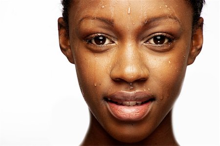 pedi - African woman with natural make-up headshoot with drops on her skin Foto de stock - Super Valor sin royalties y Suscripción, Código: 400-04108642