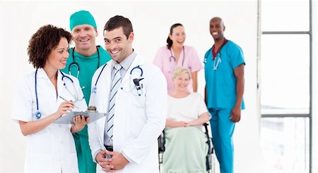 stethoscope girl and boy - Group of Doctors with patients in background Stock Photo - Budget Royalty-Free & Subscription, Code: 400-04108773