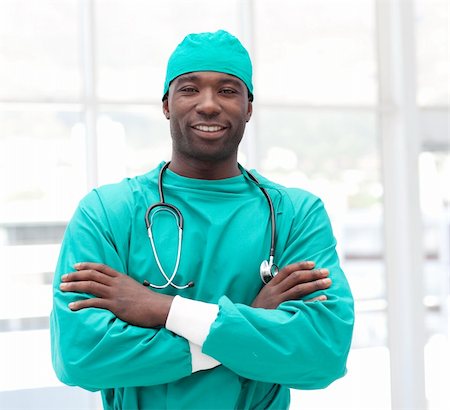 doctors office insurance patient - Male african American Surgeon with arms Folded Stock Photo - Budget Royalty-Free & Subscription, Code: 400-04108792