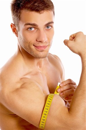 Muscular and tanned man is being measured Stock Photo - Budget Royalty-Free & Subscription, Code: 400-04108932
